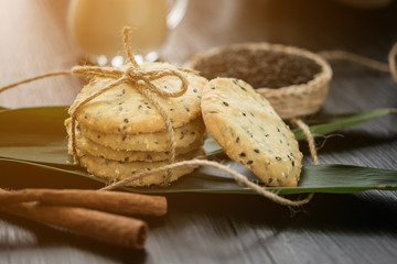 cookies with sesame seeds and glass of milk