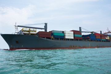 big ship in the ocean transport tank container to international terminal port on solf sky background.