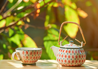 Tea set on sunny light