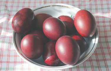 Painted red easter eggs in a bowl.Traditional food for the Easter holiday.Top view. 