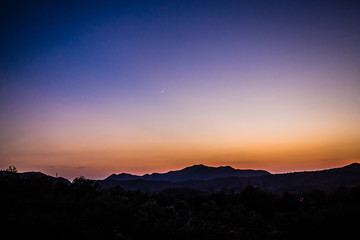 The evening, the hills, the moon, the sunset