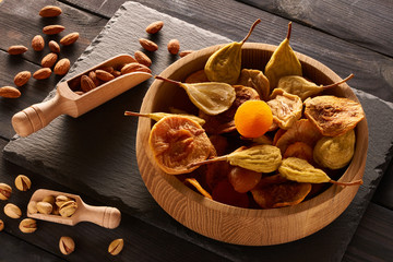 Dried fruits and nuts on slate plate