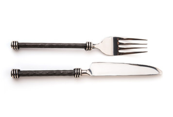 Closeup view of spoon and fork isolated on white background