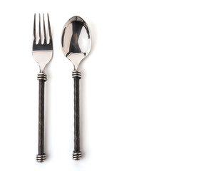 Closeup view of spoon and fork isolated on white background