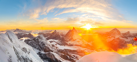 Sun setting close to Matterhorn - obrazy, fototapety, plakaty