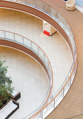 Fototapeta premium geometric patterns from multi-level balconies in the architecture of an empty shopping center building