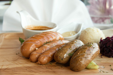 grill sausage barbecue in wood plate with sauce