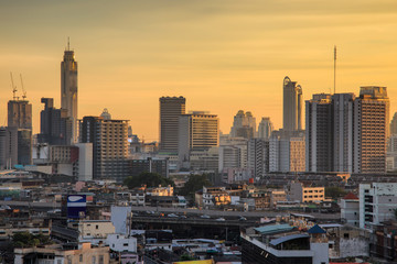 Aerial view modern office buildings in Bangkok city downtown with sunrise time, Bangkok Province, Thailand