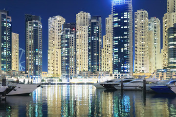 Naklejka na ściany i meble Illumination of night Dubai cityscape