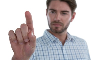Man pretending to touch an invisible screen