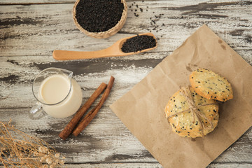 cookies with sesame seeds and glass of milk