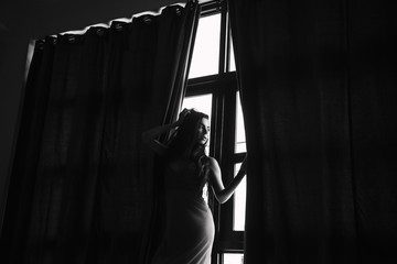 Portrait of woman near the window