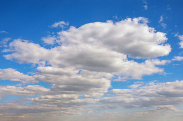 White Cumulus clouds in blue sky, perspective view