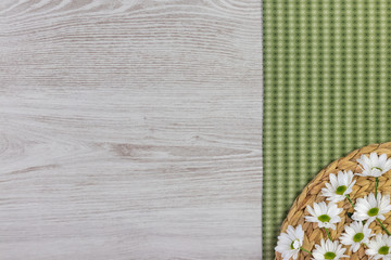 Garden flowers composition on white wooden table with copy space.