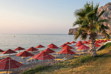 The main beach of Kolymbia, a sun-soaked resort in an idyllic place between mountains and the sea. Rhodes, Greece.