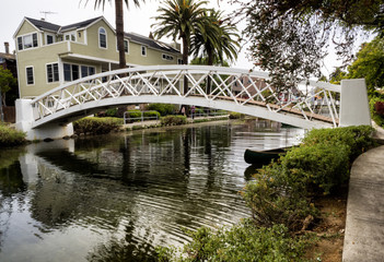 Fototapeta na wymiar Venice Canals, white bridge - Venice Beach, Los Angeles, California, USA