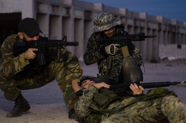 Fototapeta premium group of soldiers protect and rescue crow