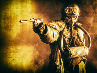 Futuristic nazi soldier in fire and smoke gas mask and steel helmet with luger pistol handgun