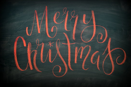 MERRY CHRISTMAS chalk lettering on blackboard