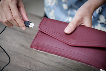 women hand charging money wallet