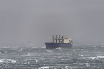 Cargo ship at sea during a storm