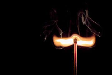 Matchstick igniting on background detailed close up macro. Concept for inspiration, getting new idea, starting new project.