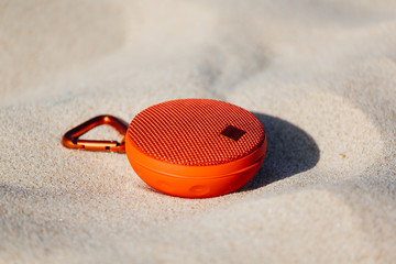 Fototapeta na wymiar Portable wireless speaker on the beach