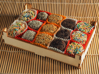 Turkish sweets from dried fruits in a wooden package.