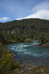 River Futaleufu flowing through a forested valley in the Aysén Region of southern Chile. The river is renowned as one of the premier locations in the world for white water rafting.