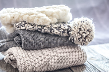 Fototapeta na wymiar beautiful knitted clothes, neatly folded, close-up, handmade sweaters.