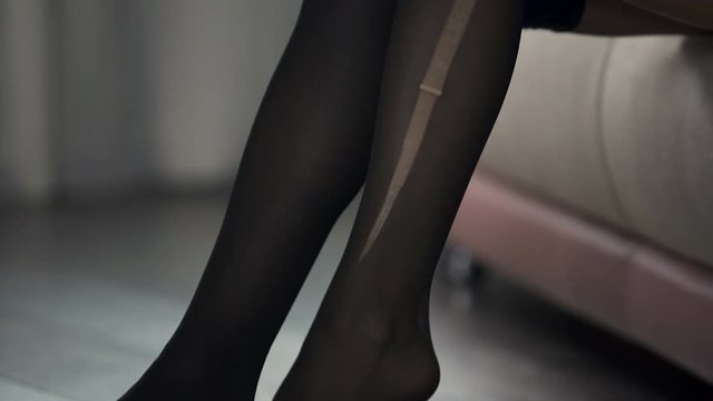 Lady in hurry going to work and accidentally tearing pantyhose, bad start of day
