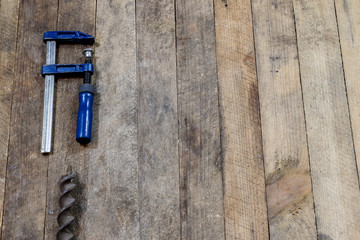 Tools on a wooden table in an old workshop. Arranged on the edge of the table. wooden table.