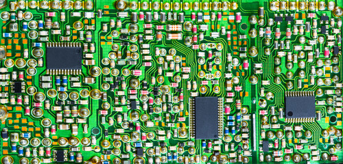 Impressive printed circuit board with many electronic parts. Varied electrotechnical background...