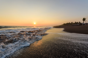 Sunset at Beach with Black Sand in Monterrico, Pacific coast of Guatemala. 