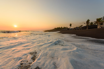 Sunset at Beach with Black Sand in Monterrico, Pacific coast of Guatemala. 