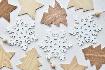 wooden christmas trees, snowflakes, and stars background