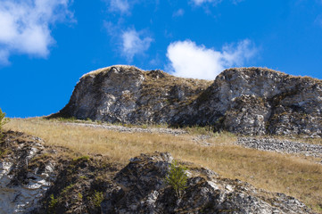 photograph of a mountain landscape on the blue sky background