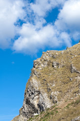 photograph of a mountain landscape on the blue sky background