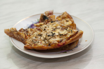 photo of hot cooked pizza on a plate