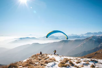 Photo sur Plexiglas Sports aériens taking picture to a paraglider takeoff on the mountain. Italian Alps