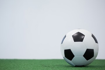 Football kept on artificial grass