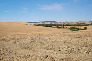 Fototapeta na wymiar Plowed field ready to be cultivated in Val d'Orcia, Tuscany