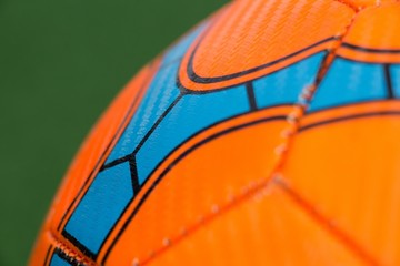 Football against green background