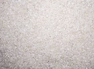 raw white long grain rice closeup background