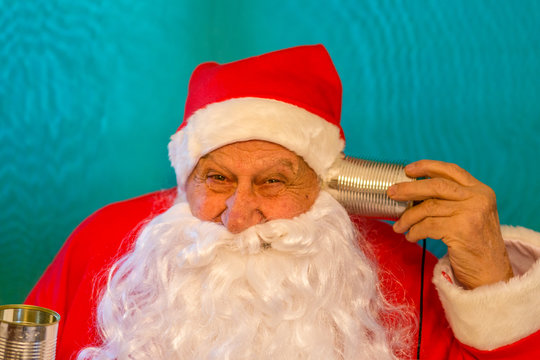 Santa Claus  with tin can telephone