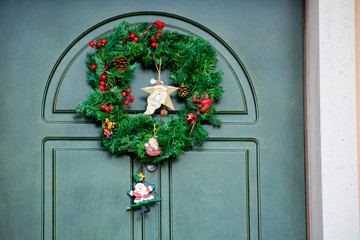 Fototapeta na wymiar Christmas Decoration On a Cyan Door