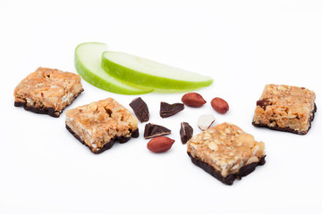 Cereal bar bits apple chocolate and peanuts