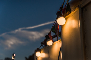 Vintage antique hanging light bulbs at a street food market. Holidays and business good idea...