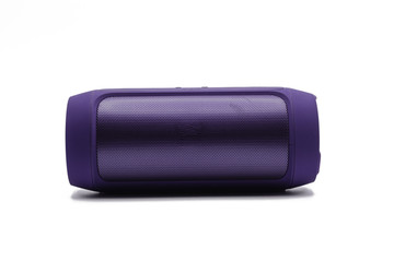 Purple Wireless or Bluetooth portable speaker for connecting to other device in white background or...