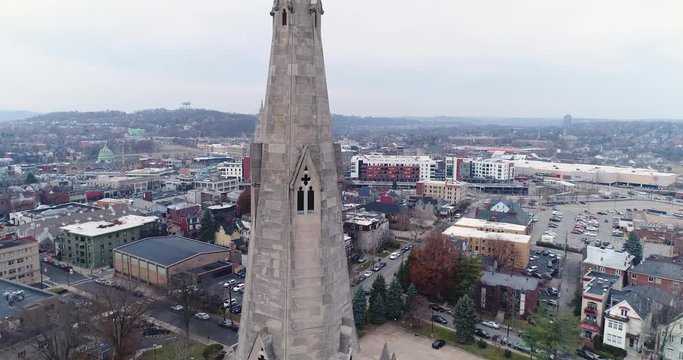 A daytime winter overcast rising aerial shot of the steeple on Calvary Episcopal Church in Pittsburgh's Shadyside District.	 	